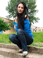 Skinny teen model posing on the green field