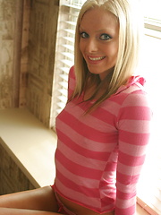 Petite teen babe Skye teases with her perky tits as she lifts her pink striped shirt