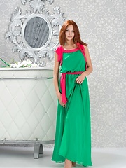 Lydia A briefly poses in her green maxi dress with hot pink belt before stipping naked and playfully posing in front of Alex Iskan\'s camera